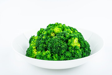 Broccoli on a dish on white background