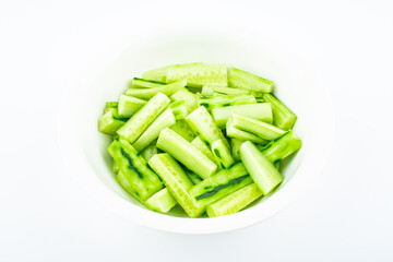 A pot of cut cucumber strips
