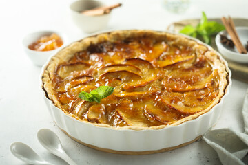 Traditional homemade apple tart with apricot jam