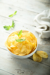 Potato chips in a white bowl