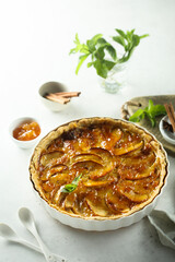 Traditional homemade apple tart with apricot jam