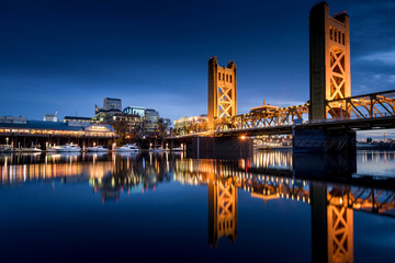 Sacramento Tower Bridge in the twilight with the Ziggurat Building in the background, Riverfront Park, West Sacramento. 
