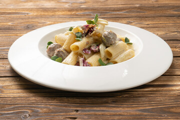 Rigatoni pasta with meatballs and bechamel sauce