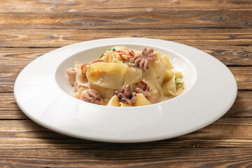 Pappardelle pasta with octopus and bacon