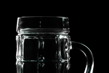 Close-up of an empty beer mug on a black background