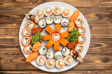 A large beautiful sushi set with maki rolls, nigiri and gunkans