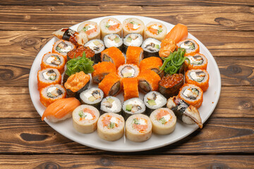 A large beautiful sushi set with maki rolls, nigiri and gunkans
