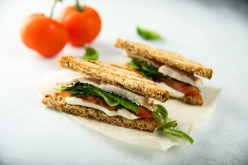 Chicken sandwich with tomato and cheese