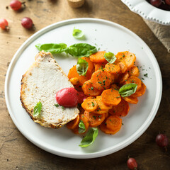 Homemade roasted pork with carrot and gooseberry sauce