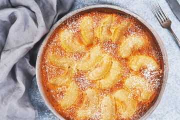 Composition with delicious apple tart on light background