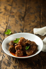Traditional homemade meatballs with fresh basil