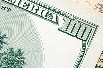 Close-up elements of a hundred dollar bill. Finance background and dollar exchange rate