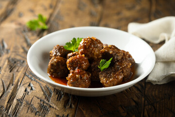 Traditional homemade meatballs with fresh basil