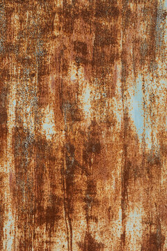 Textured grunge background red peeling paint with rust on old metal surface © yanik88