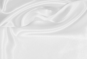 Smooth elegant white silk or satin luxury cloth texture as wedding background. Luxurious background design
