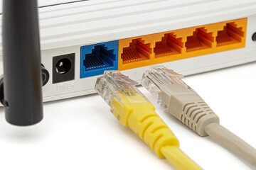 Wireless router with cables, isolated on white background