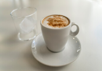 cup of coffee on white table