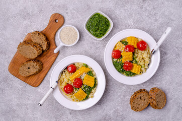 Pasta with vegetables and green sauce