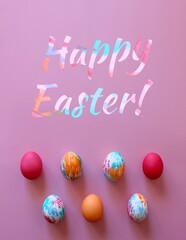 Colorful hand-painted Easter eggs on pink background. Text: Happy Easter! 