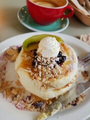 pancakes with chocolate, almond, flakes, honey, syrup