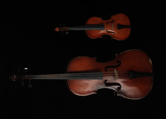 silhouette of cello and violin on black background