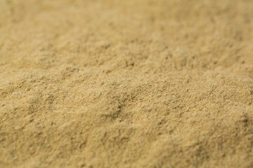 Cardamom powder on black background