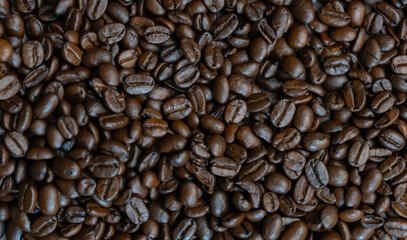 Roasted coffee beans background.Top closeup view.