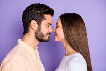 Profile side photo of pretty woman handsome man touch noses lovers good mood isolated on violet color background