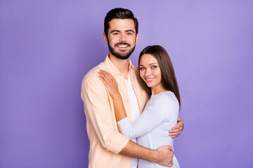 Photo of positive people married couple hug each other happy relationship isolated on purple color background