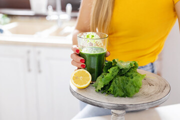 Green detox smoothie with vegetables on the table in the kitchen. Healthy drink, Detox, Diet