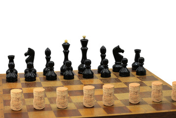 Abstract photo with chess pieces and wine corks on chessboard isolated on white background