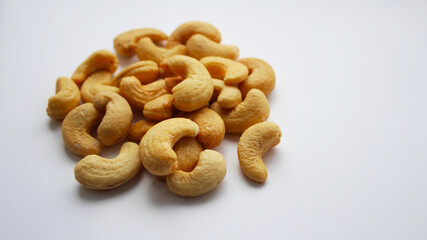 Roasted cashews without shell. Top view of cashew nut isolated on white background. Set or collection. Selective focus.