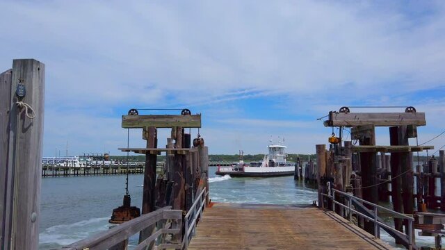 Panning Shot of Pier and Ferry Leaving the Terminal in Green Port Long Island