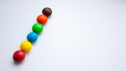 Colorful chocolate candy treat on white isolated background. ММ