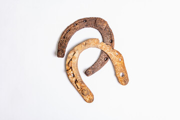 Cast iron metal horseshoes isolated on white background