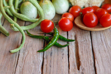 Raw mixed vegetables on wooden table