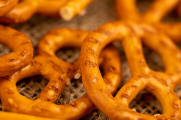 Salted breadsticks and salted pretzels scattered on the table.