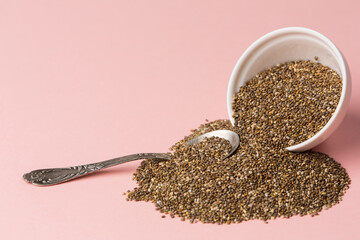 Chia seeds on pink background