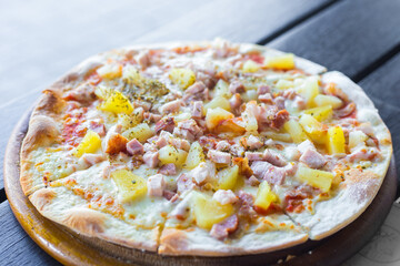 Hawaiian pizza is a Italian food which it made with tomato sauce, chopped pineapple, ham and cheese.