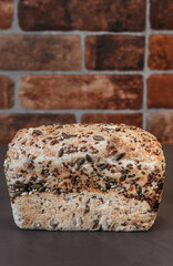 Fresh baked homemade rye bread, top view. Bread with nuts and candied fruits.