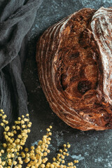 Fresh baked homemade rye bread, top view. Bread with nuts and candied fruits.