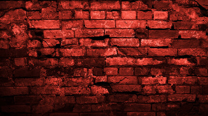 Old dilapidated brick wall. Red toned brick background with copy space for design. Web banner. Horror, Halloween, decay, gothic concept.