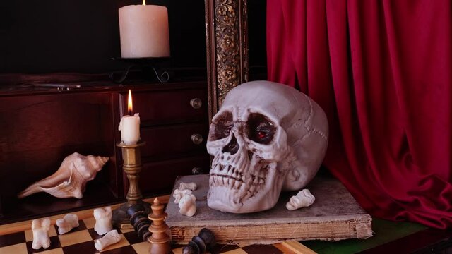 allegorical still life in the baroque genre Vanitas, a skull on a book, chess, candles are burning, concept of the transience of life, the futility of pleasures and inevitability of death