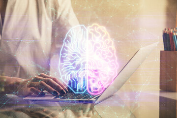 Double exposure of woman hands working on computer and brain hologram drawing. Ai concept.