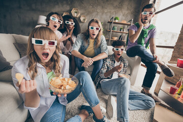Portrait of attractive amazed cheerful friends gathering watching movie having fun pastime in house...