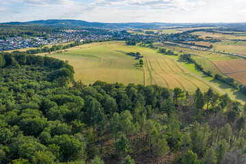 Obraz premium Bird's eye view of forests and meadows in the Taunus / Germany in spring 