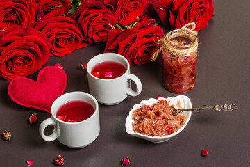 Tea time with rose petals jam and hot beverage