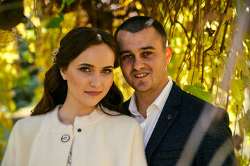 Young male and woman just married. Concept of happy family. Modern family outdoor.