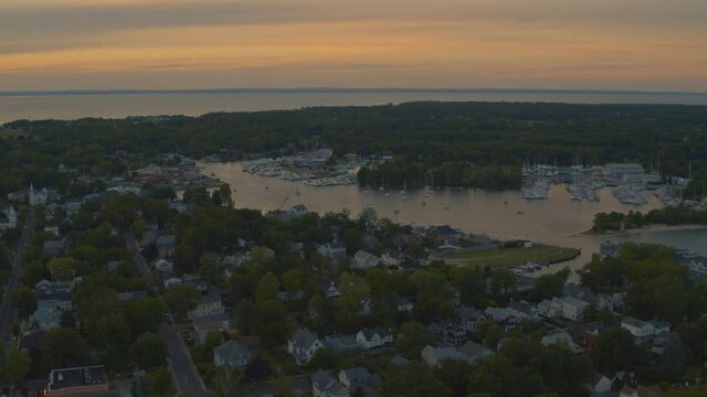 Aerial View of Suburban Houses Near Marina in Greenport at Sunset 
