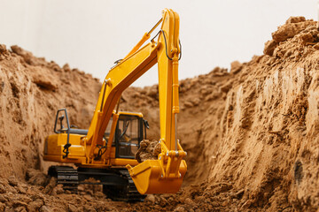 Selective focus ,bucket of excavators are digging the soil in the construction site with  on white background